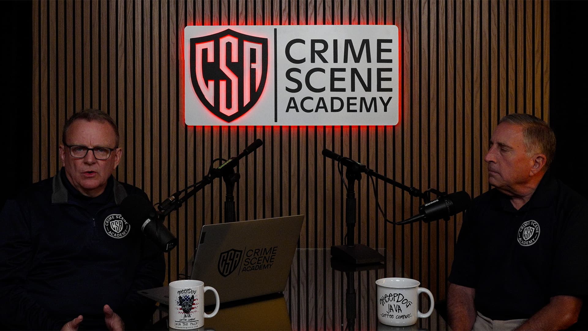 Howard Ryan and James Molinaro reviewing real-world shooting reconstruction case materials.